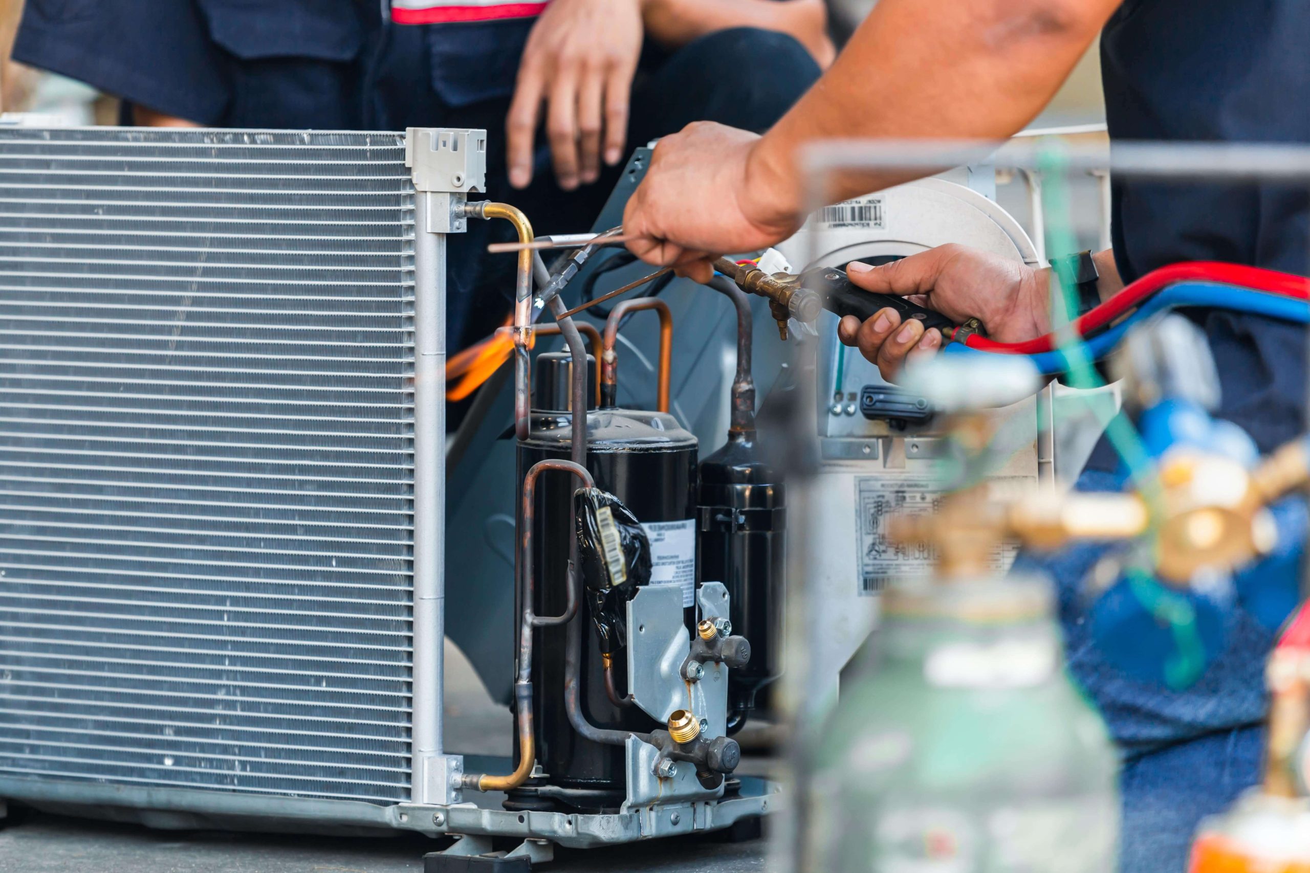 Air conditioner repair technician performing an ac repair in Alexandria, VA.