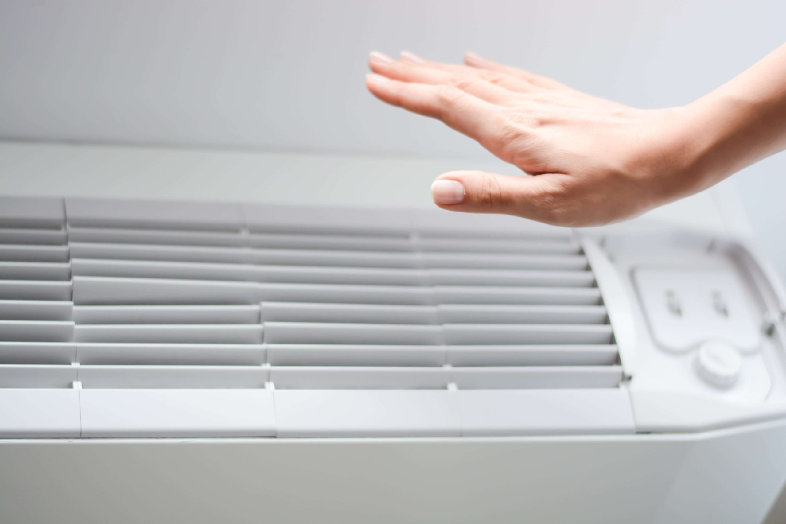 Repair technician checking the results of their A/C repair.